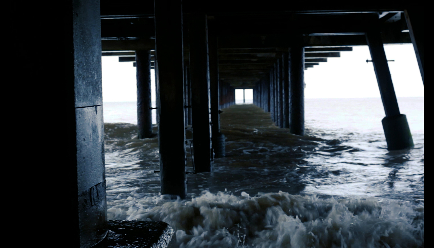 Sea water and supports underneath a pier