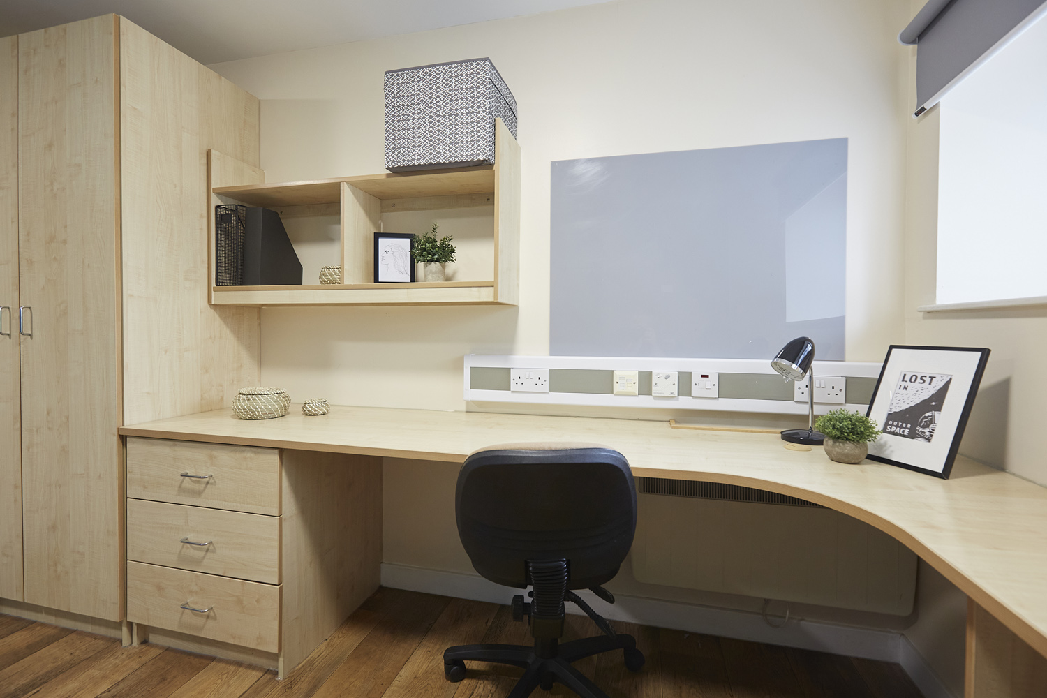 Very large corner desk space with chair and shelving unit