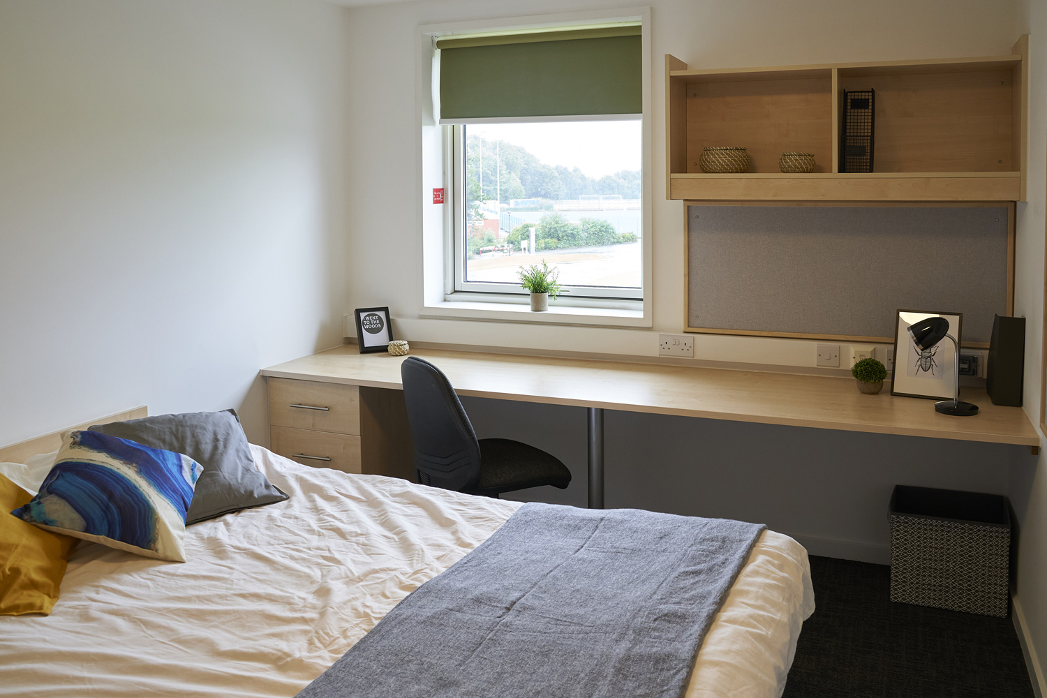student room with double bed and desk