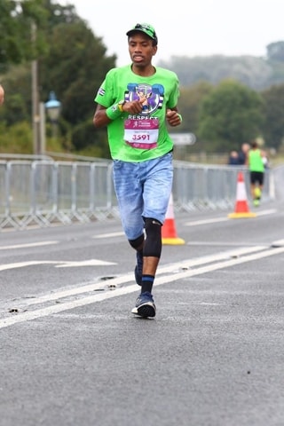 Image of man running on a road