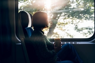 Image of person looking out of a train window