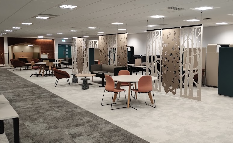 Study are in JG250 with table seating, settees and hanging partitions to break up the space.