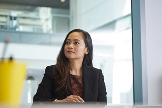 Woman in an office, looking to the side
