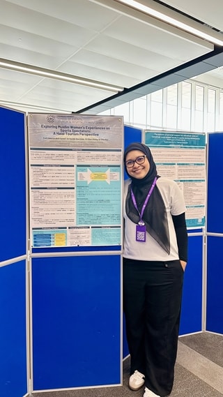 Fatin Nabilah Azren with her poster presentation at the Women in Sport and Exercise Academic Network (WiSAN) conference