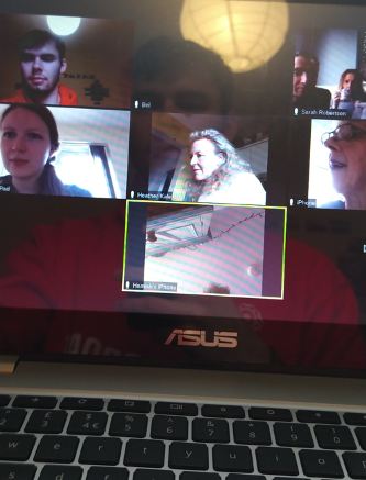 An image of a computer screen showing pictures of students on an online chat