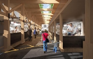 Parent and child walking through a market square