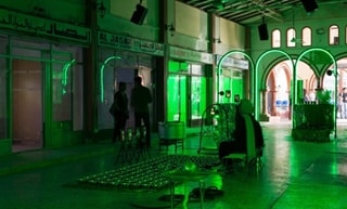 Middle-Eastern market hall illuminated in green light