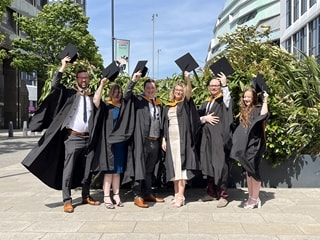 Trish and other apprentices celebrate at Graduation