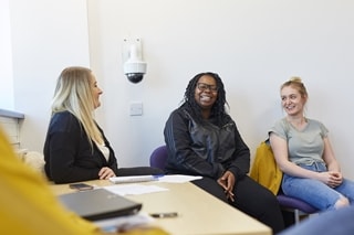 Students in a Communication Suite with facilties