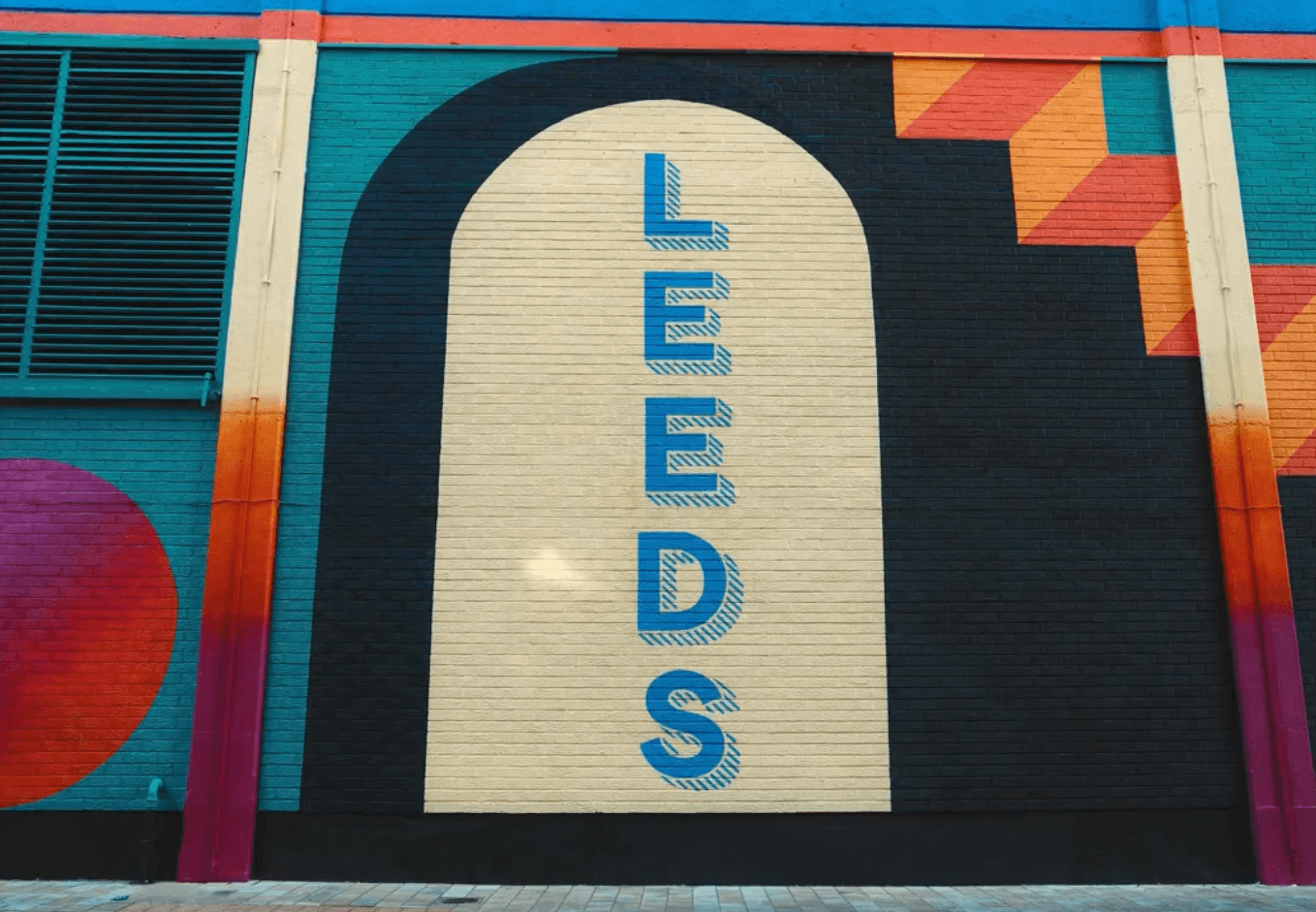 Wall art with the word "Leeds" written vertically 