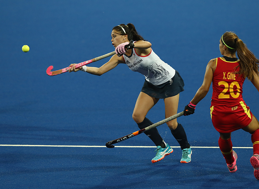 Sam Quek receiving a ball whilst playing field hockey