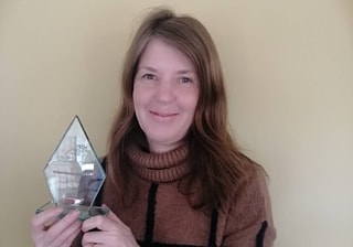 Degree Apprenticeship student, Sonia Rides, holding award