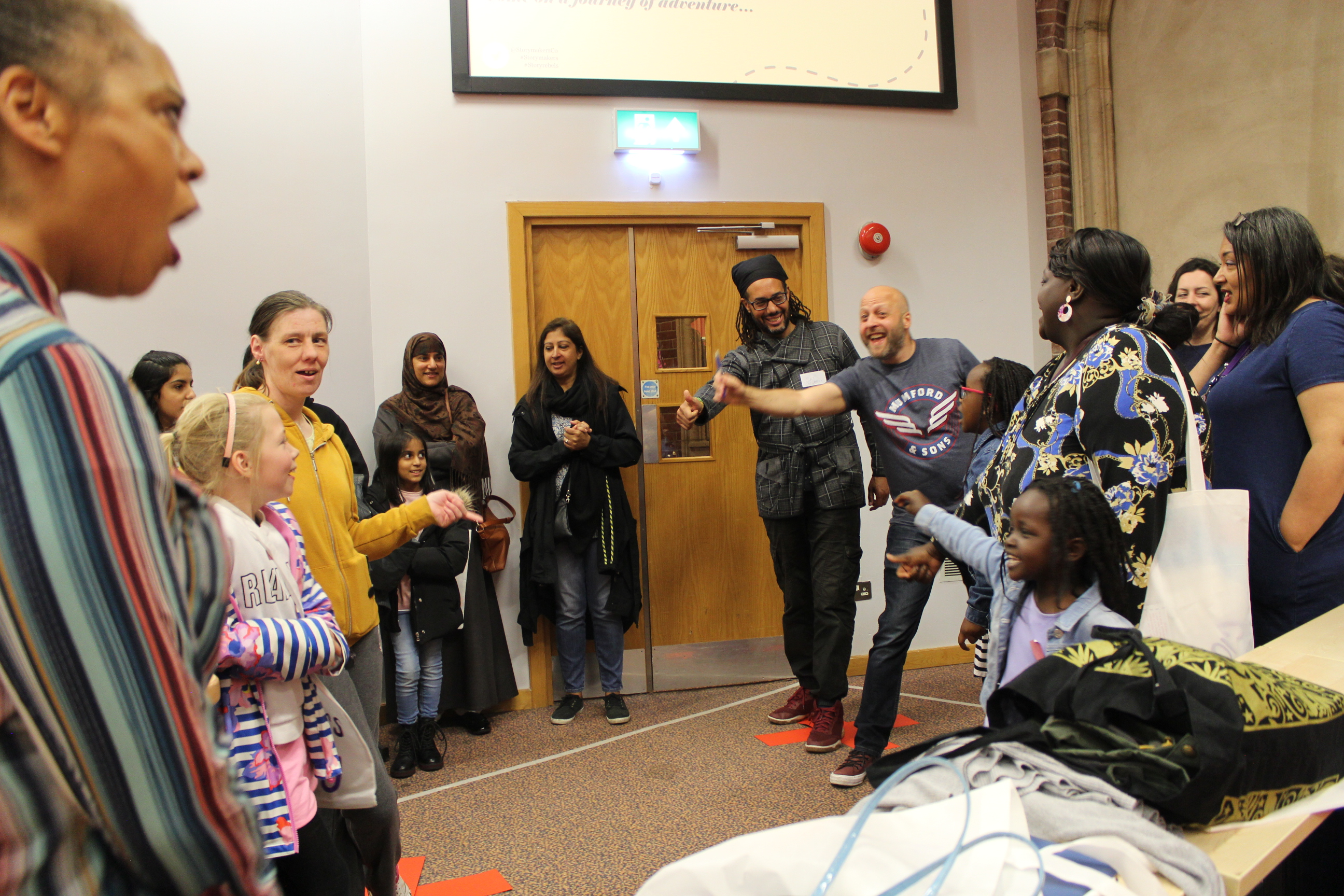 story makers festival, children and artists stand in a circle